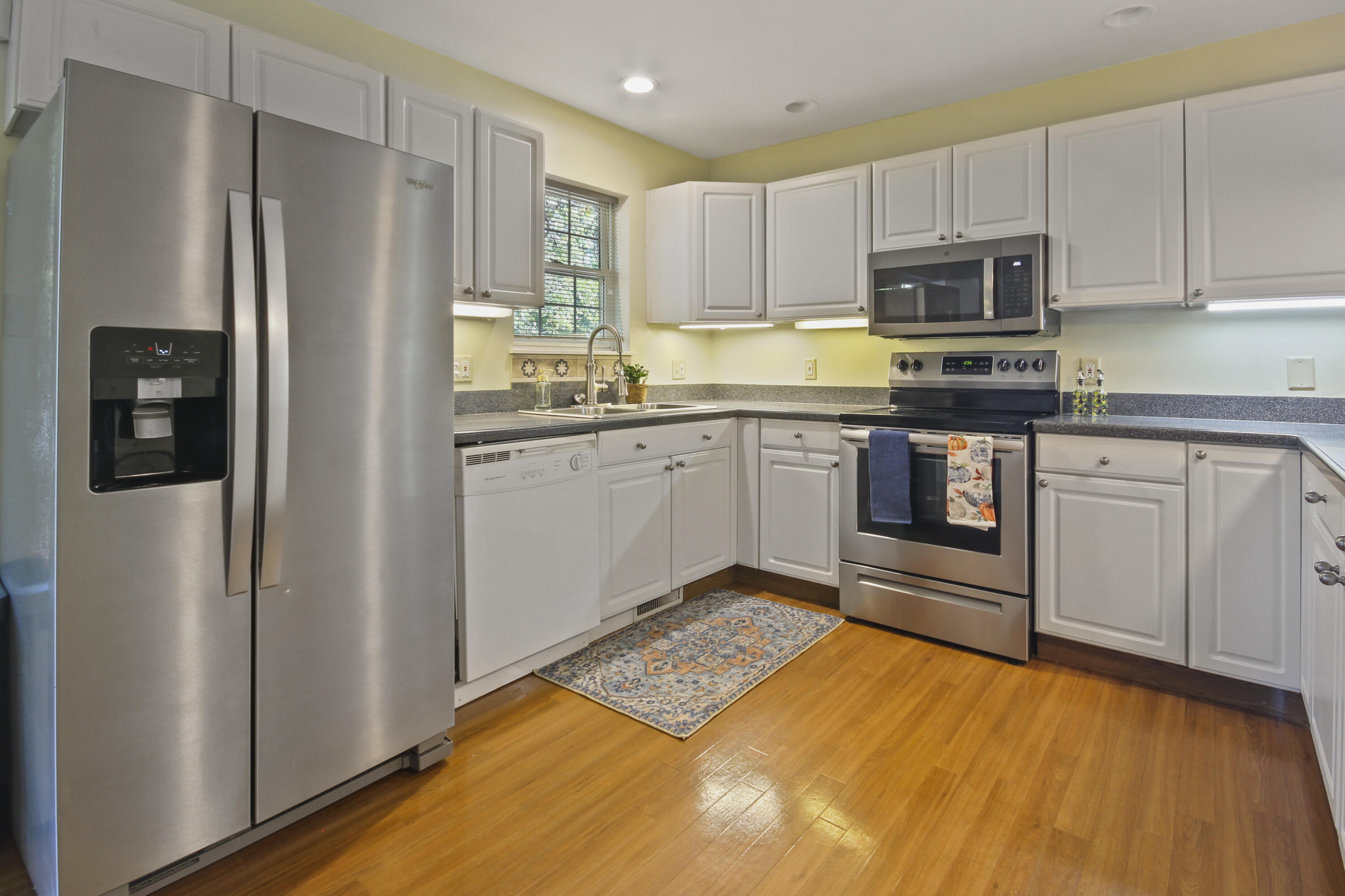 739 Montgomery Street Gary, IN 46403 - Photo 11 of 34 a kitchen with stainless steel appliances granite countertop a refrigerator and a stove top oven