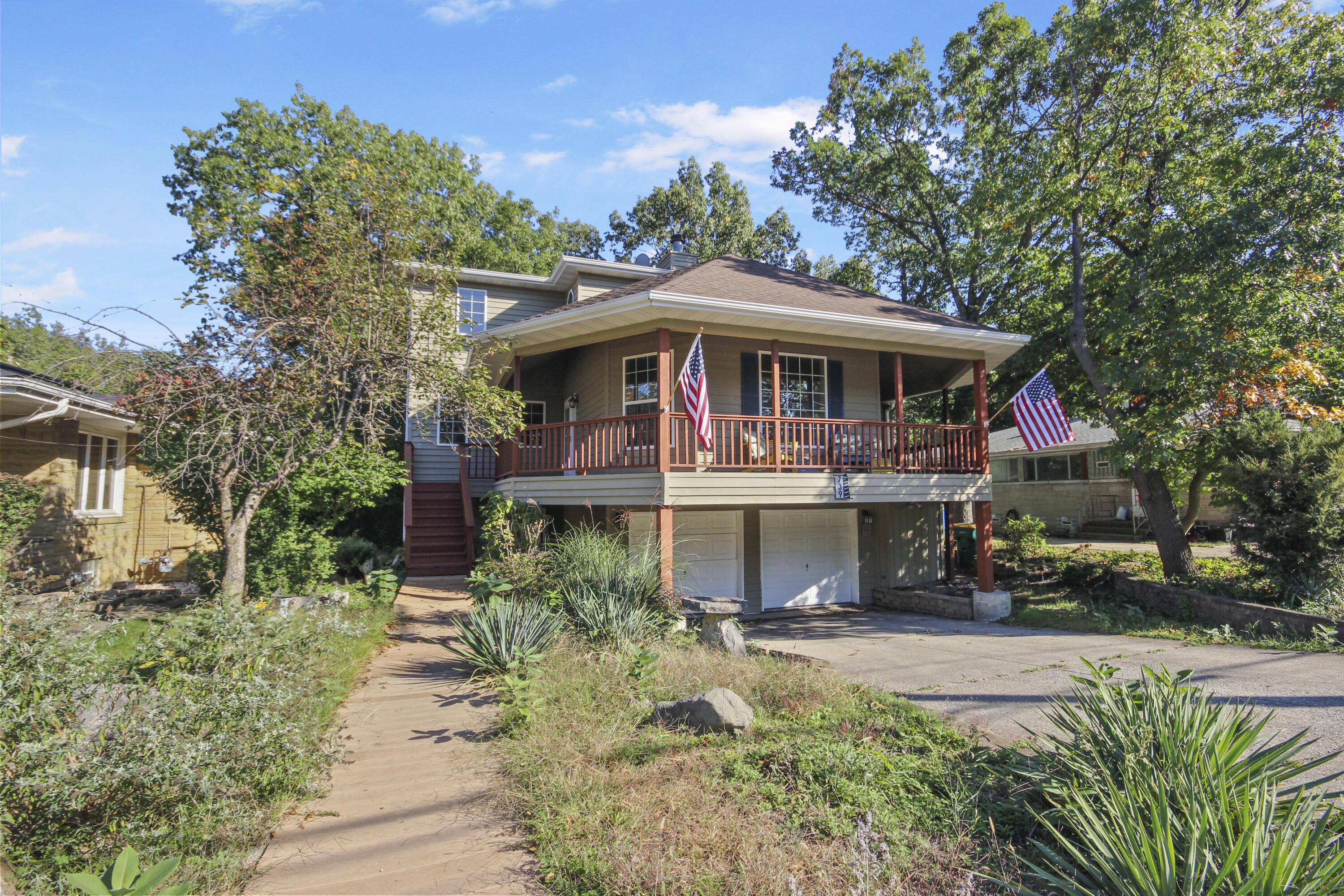739 Montgomery Street Gary, IN 46403 - Photo 4 of 34 a view of a garden with a bench and trees