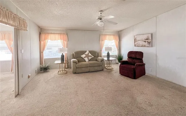 a living room with furniture and a window