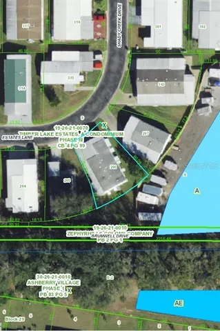 an aerial view of residential houses with outdoor space and swimming pool