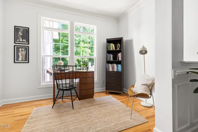 a work room with furniture and a window