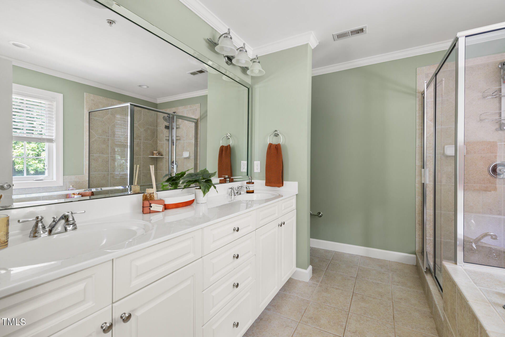 204 Towne Ridge Lane Chapel Hill, NC 27516 - Photo 24 of 36 a bathroom with a double vanity sink mirror double and shower