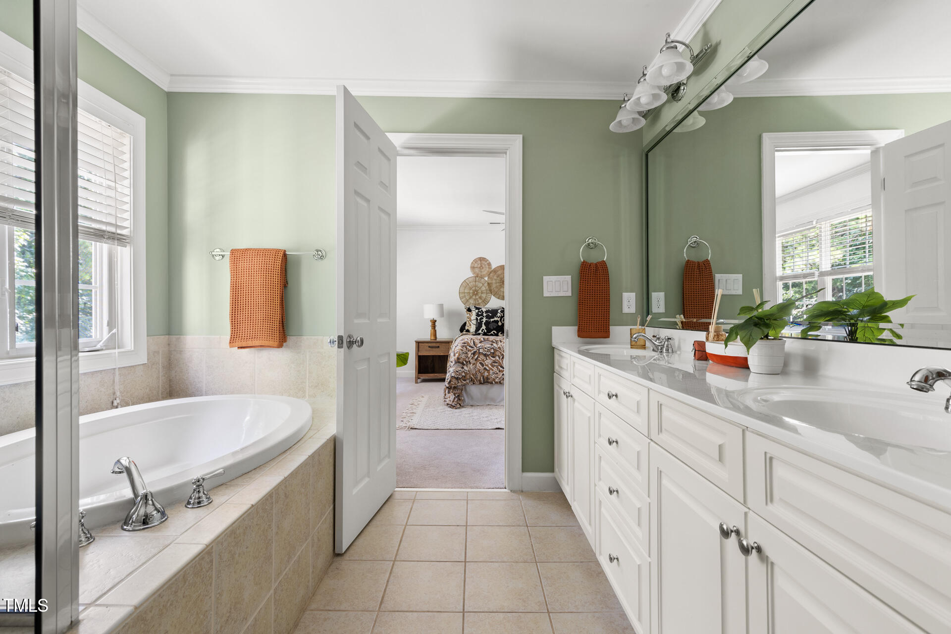 204 Towne Ridge Lane Chapel Hill, NC 27516 - Photo 25 of 36 a bathroom with a tub sink and mirror