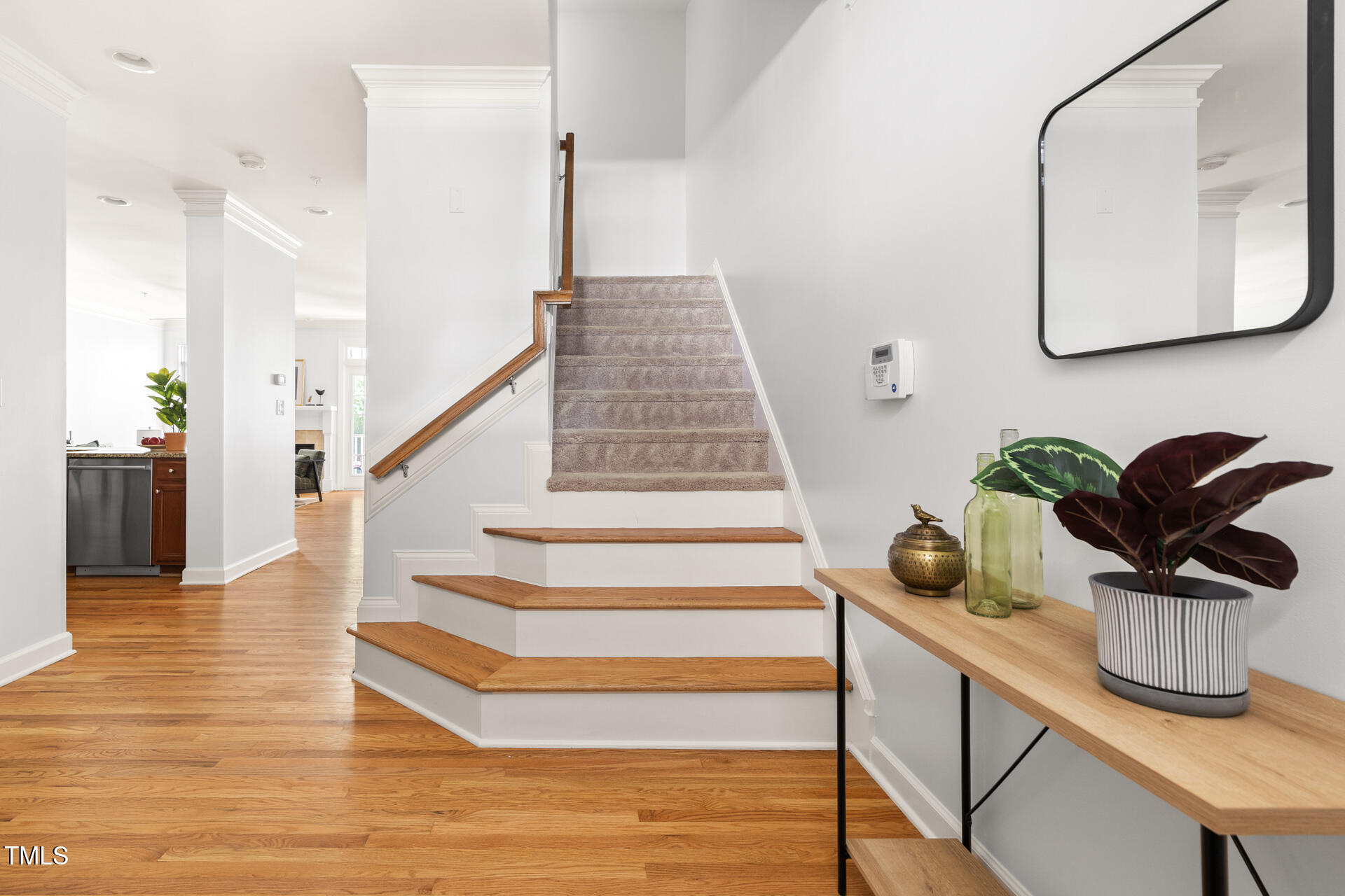 204 Towne Ridge Lane Chapel Hill, NC 27516 - Photo 5 of 36 a view of staircase with white walls and a potted plant