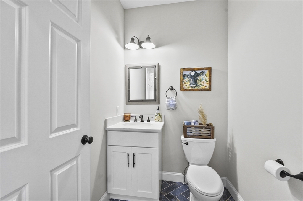112 Nourse Road Bolton, MA 01740 - Photo 13 of 42 a bathroom with a toilet a sink and mirror
