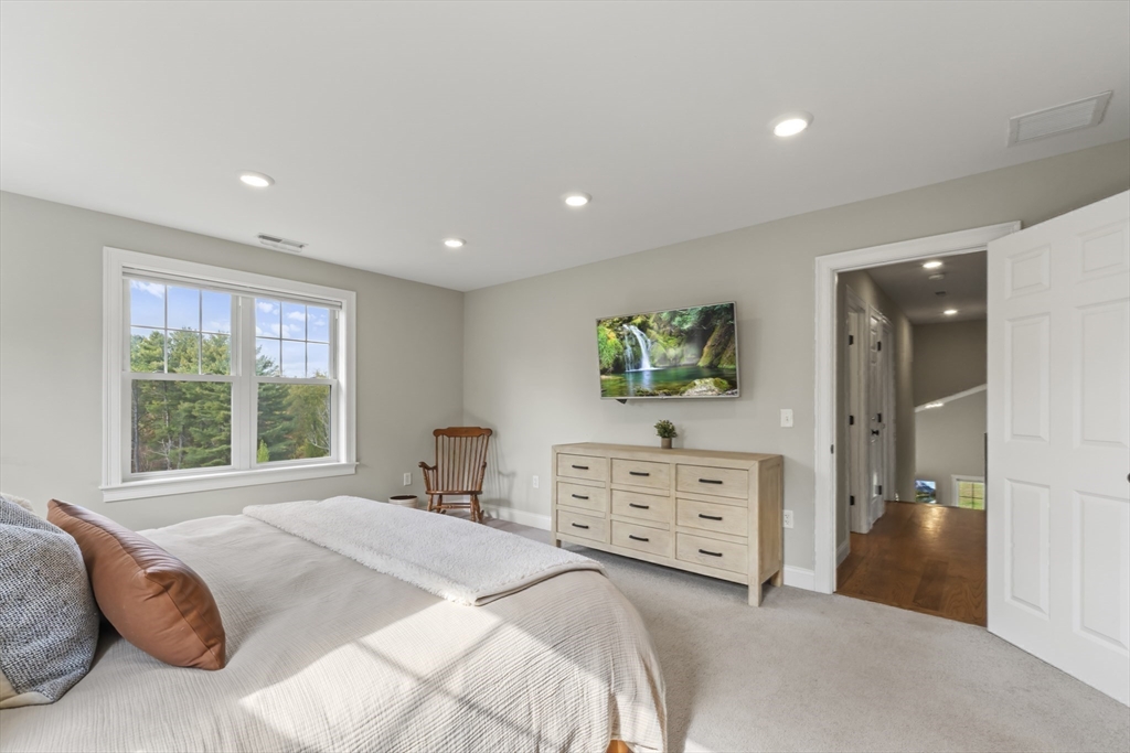 112 Nourse Road Bolton, MA 01740 - Photo 29 of 42 a bedroom with a bed and a dresser