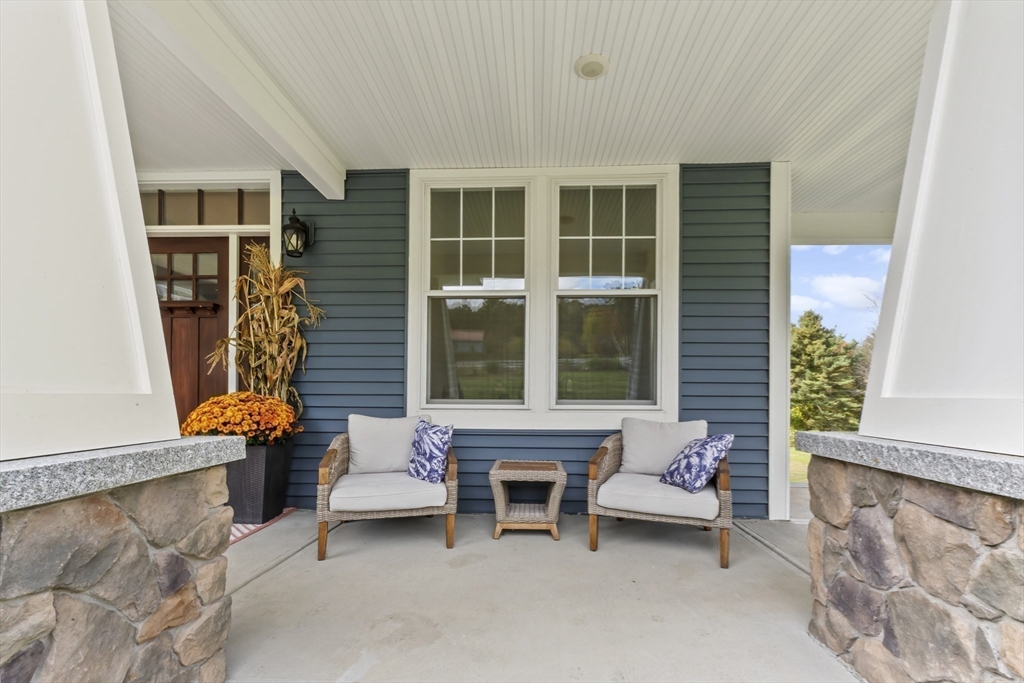 112 Nourse Road Bolton, MA 01740 - Photo 3 of 42 a building outdoor space with patio furniture