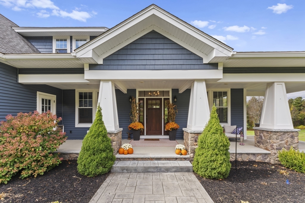112 Nourse Road Bolton, MA 01740 - Photo 4 of 42 a view of a house with outdoor seating space