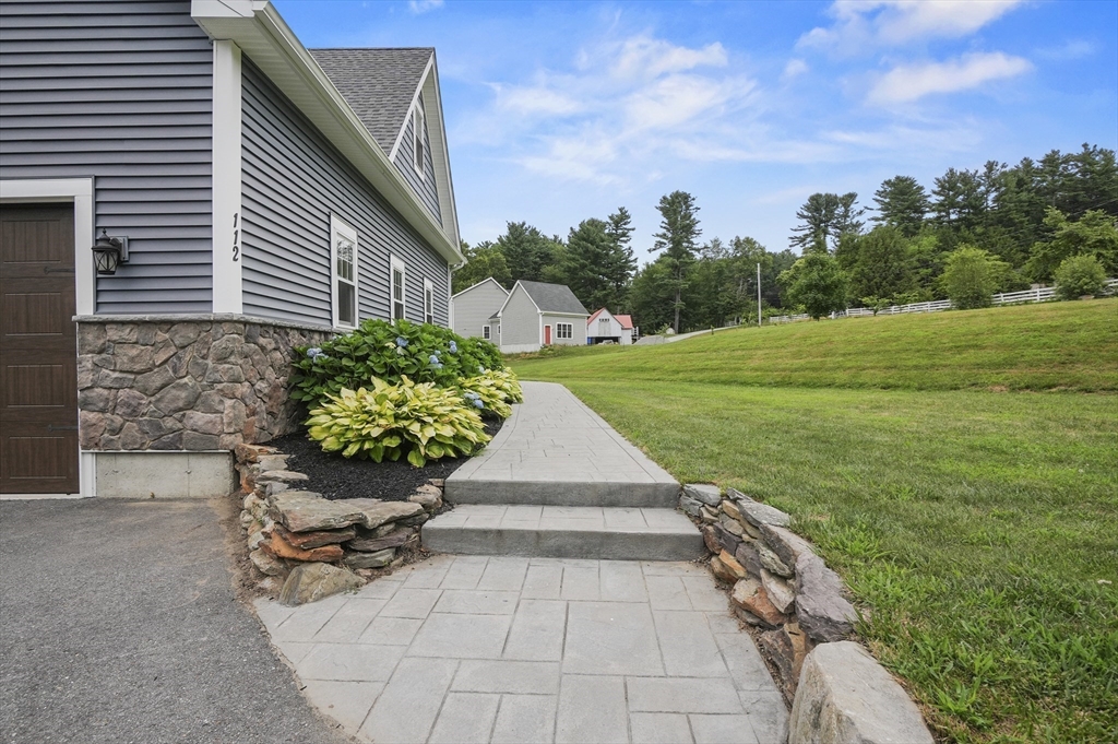 112 Nourse Road Bolton, MA 01740 - Photo 42 of 42 a view of a backyard with sitting area