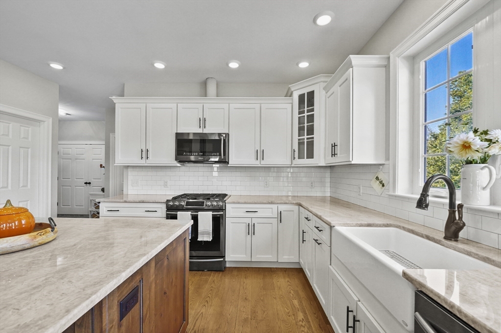 112 Nourse Road Bolton, MA 01740 - Photo 9 of 42 a kitchen with a sink stove top oven and microwave