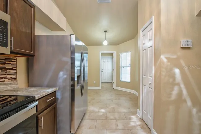a view of a kitchen cabinets and wooden floor