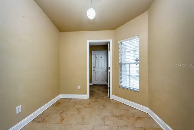 an empty room with windows