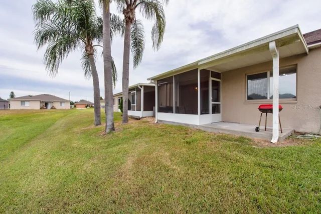 a house with palm tree in front of it