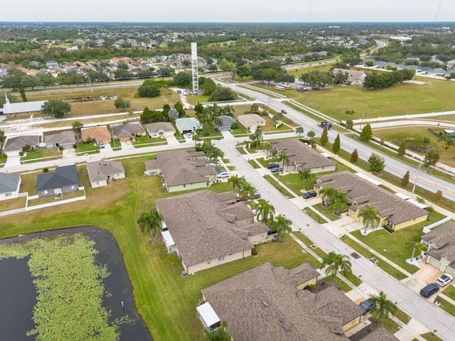 an aerial view of residential houses with outdoor space