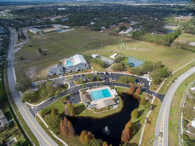 an aerial view of a house with swimming pool