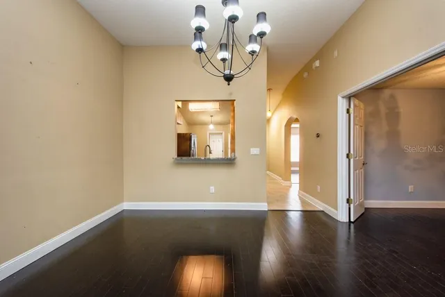 a view of a room with wooden floor and painted walls