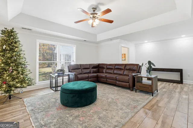 a view of a dining room with furniture and a window