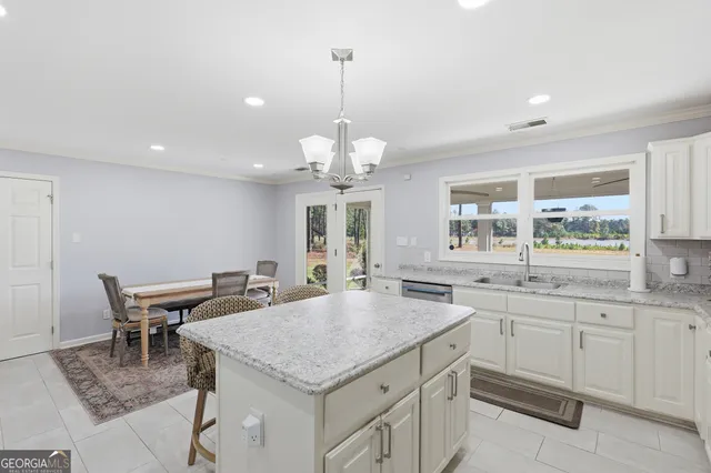 a bathroom with a tub and a sink