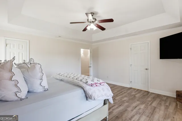 a view of a livingroom with furniture and a flat screen tv