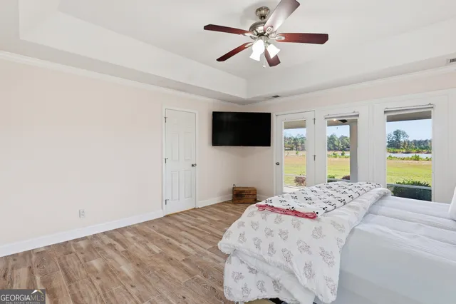 a view of a room with wooden floor and sink