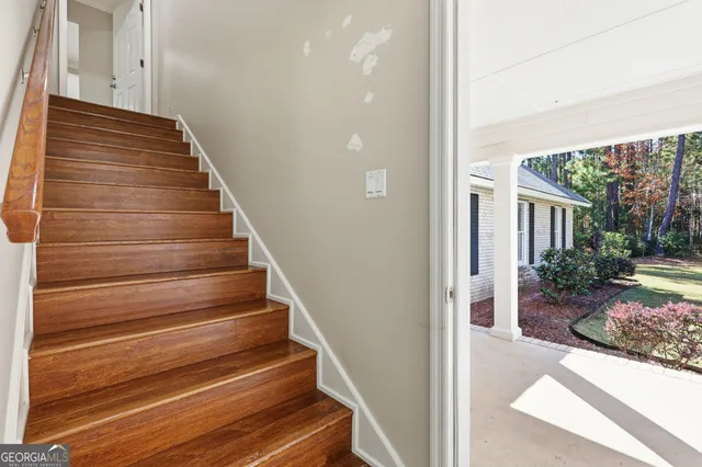 a living room with furniture and a rug