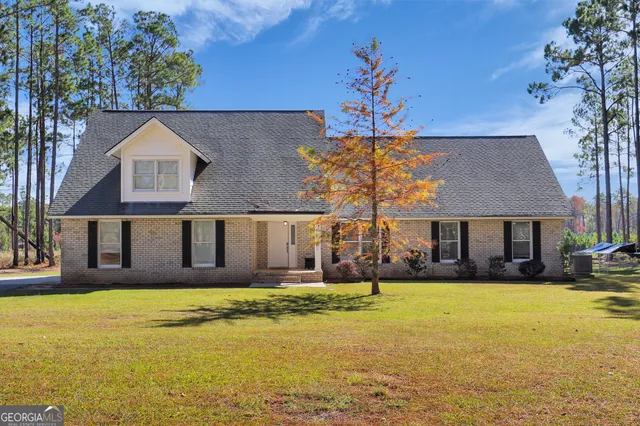 a front view of a house with a swimming pool
