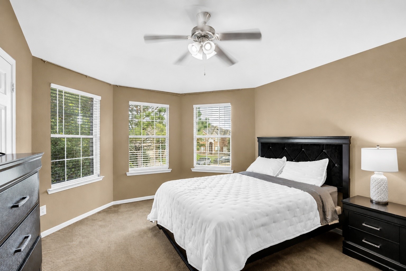 611 River Delta Lane Rosenberg, TX 77469 - Photo 34 of 39 a bedroom with a large bed and a tv