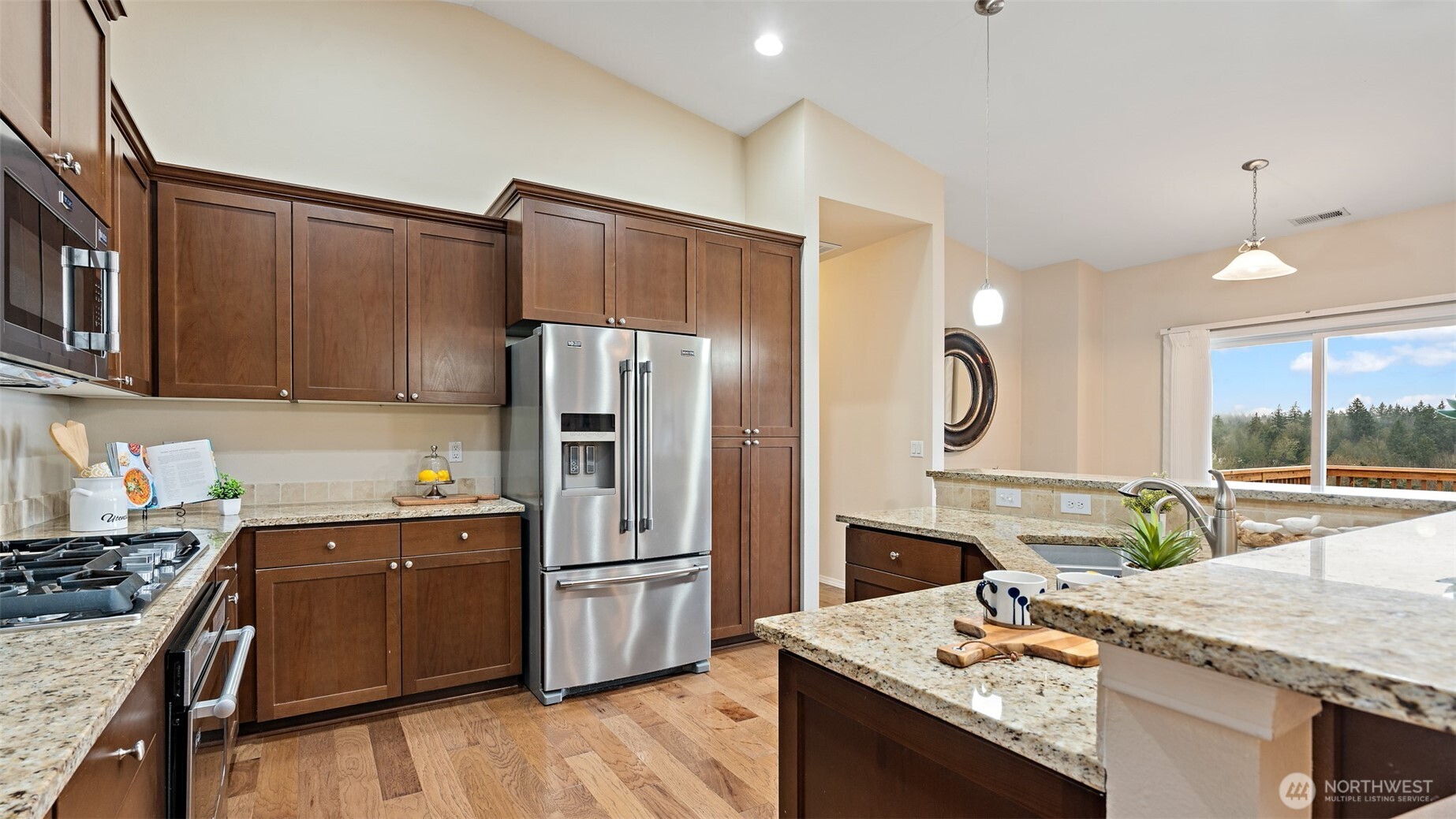 25965 Tytler Road Northeast Poulsbo, WA 98370 - Photo 14 of 40 a kitchen with a sink stove and refrigerator