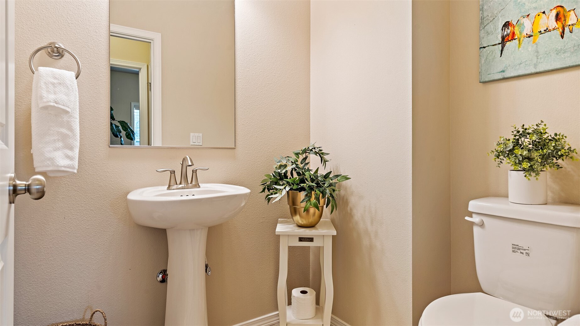 25965 Tytler Road Northeast Poulsbo, WA 98370 - Photo 20 of 40 a bathroom with a toilet sink and mirror