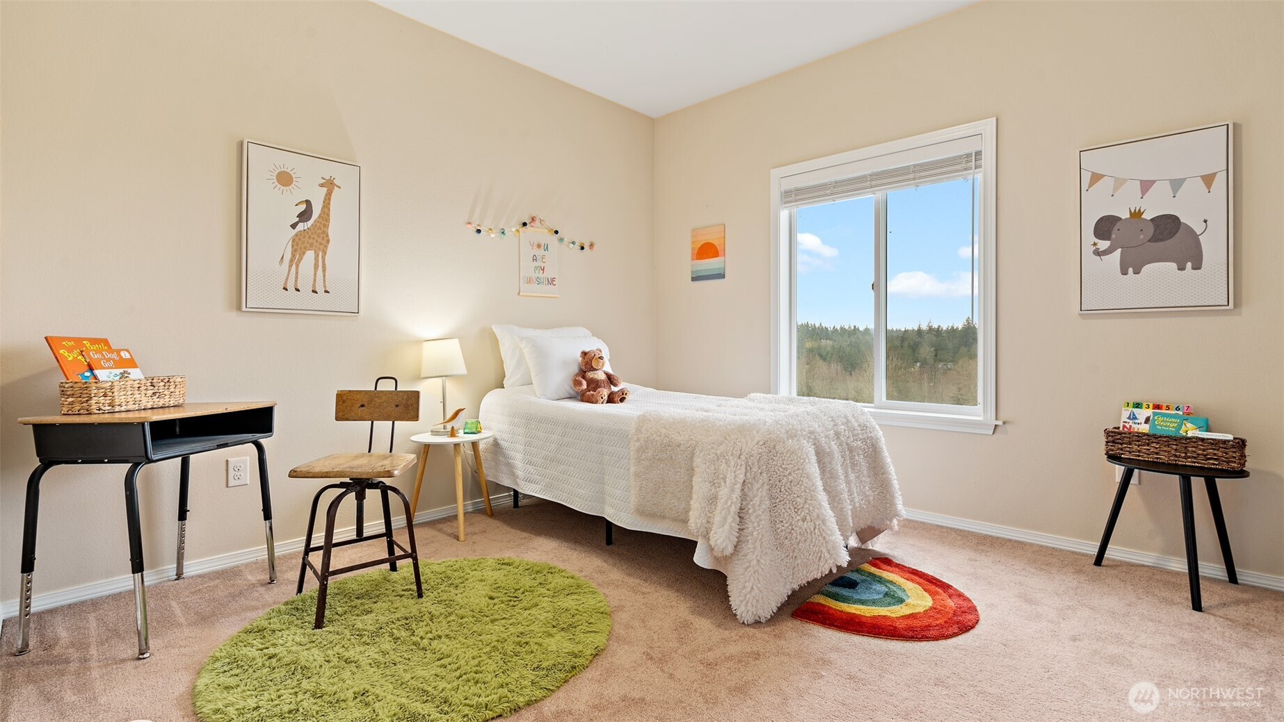 25965 Tytler Road Northeast Poulsbo, WA 98370 - Photo 21 of 40 a bedroom with a bed and a table in it