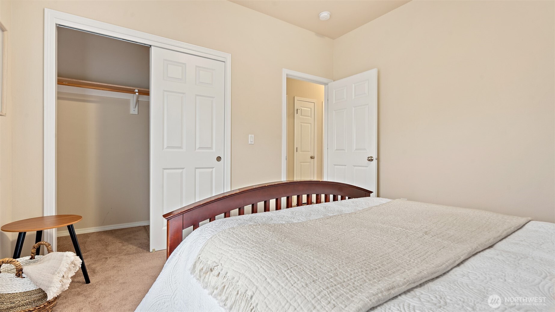 25965 Tytler Road Northeast Poulsbo, WA 98370 - Photo 24 of 40 a bedroom with a bed and a window