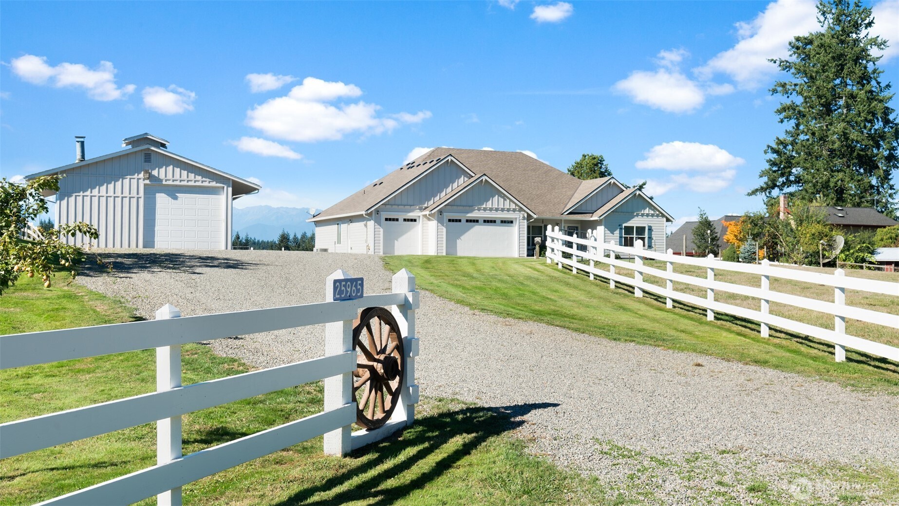 25965 Tytler Road Northeast Poulsbo, WA 98370 - Photo 26 of 40 a front view of a house with garden