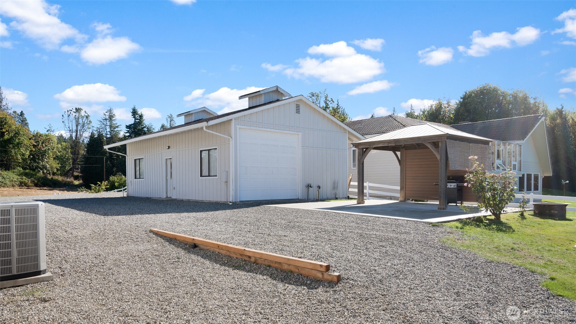 25965 Tytler Road Northeast Poulsbo, WA 98370 - Photo 27 of 40 a view of a house with backyard and sitting area