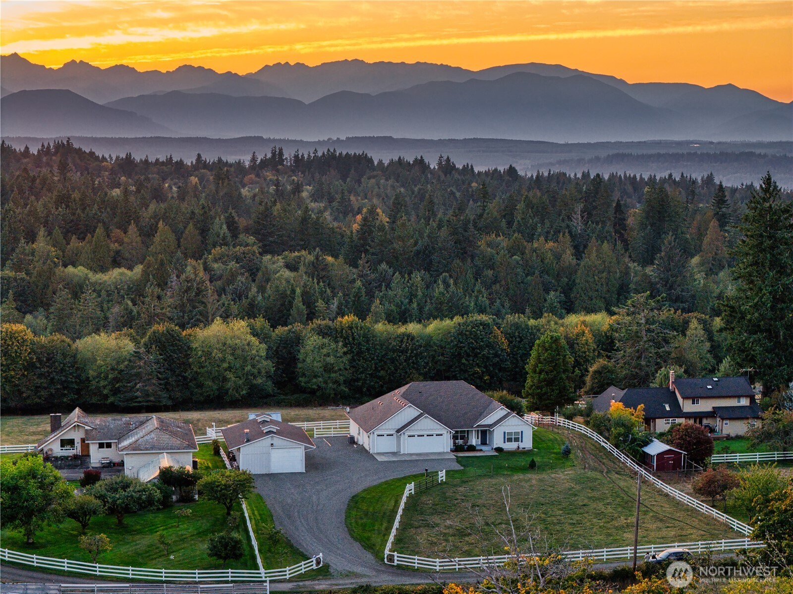 25965 Tytler Road Northeast Poulsbo, WA 98370 - Photo 3 of 40 a view of a house with a yard and street