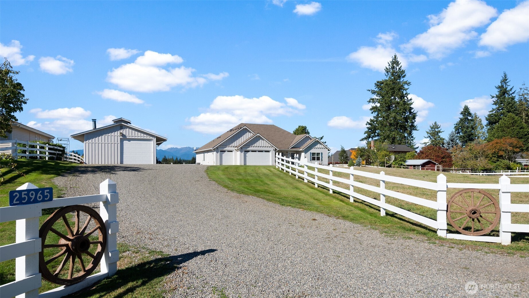 25965 Tytler Road Northeast Poulsbo, WA 98370 - Photo 34 of 40 a front view of a house with garden