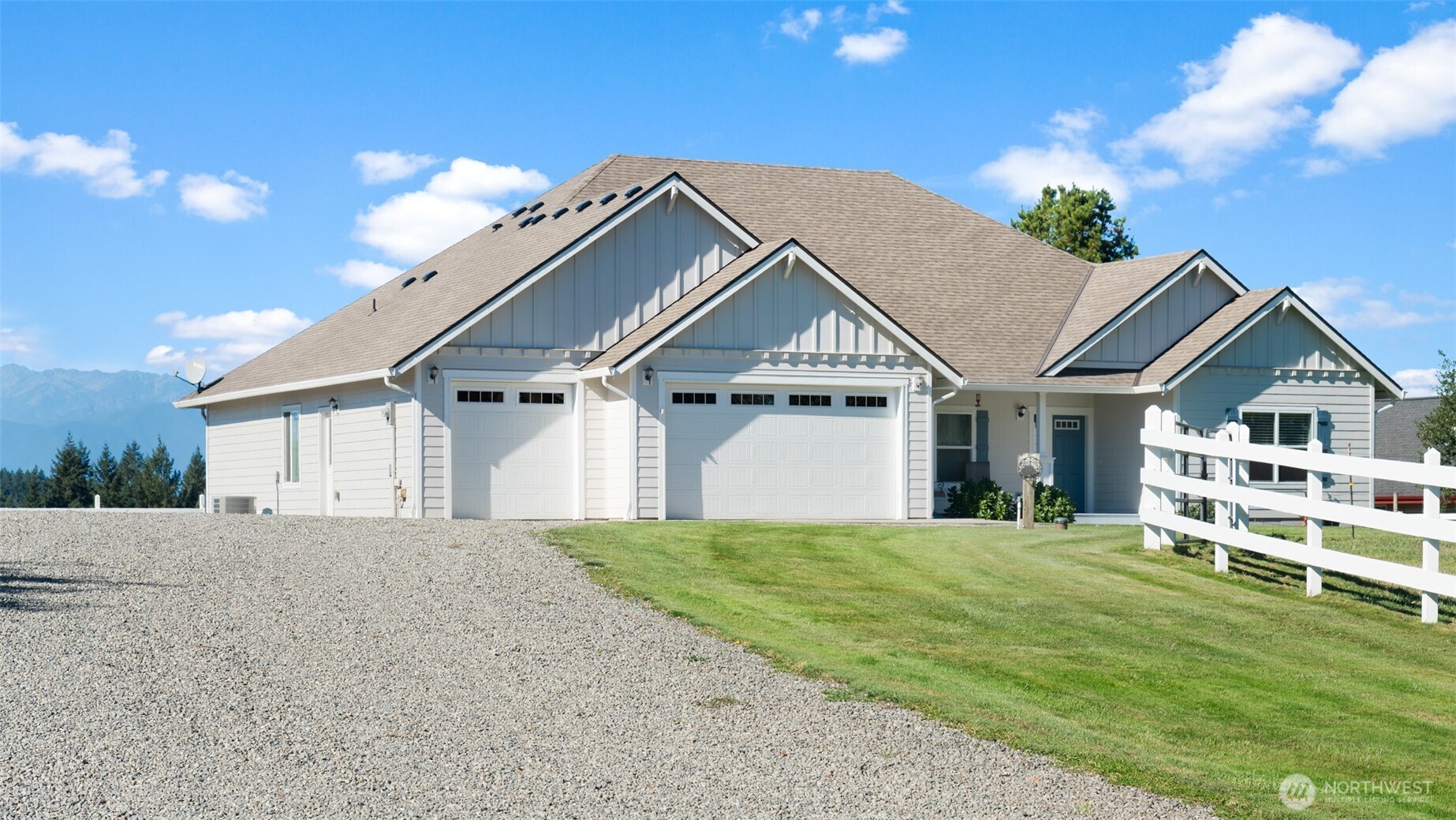 25965 Tytler Road Northeast Poulsbo, WA 98370 - Photo 35 of 40 a front view of a house with a yard