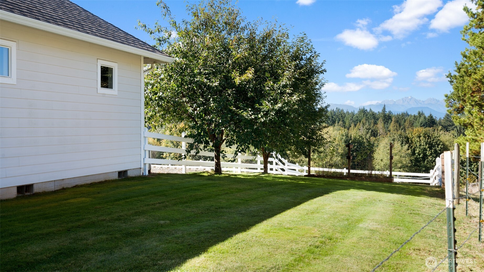 25965 Tytler Road Northeast Poulsbo, WA 98370 - Photo 40 of 40 a view of yard with grass and trees