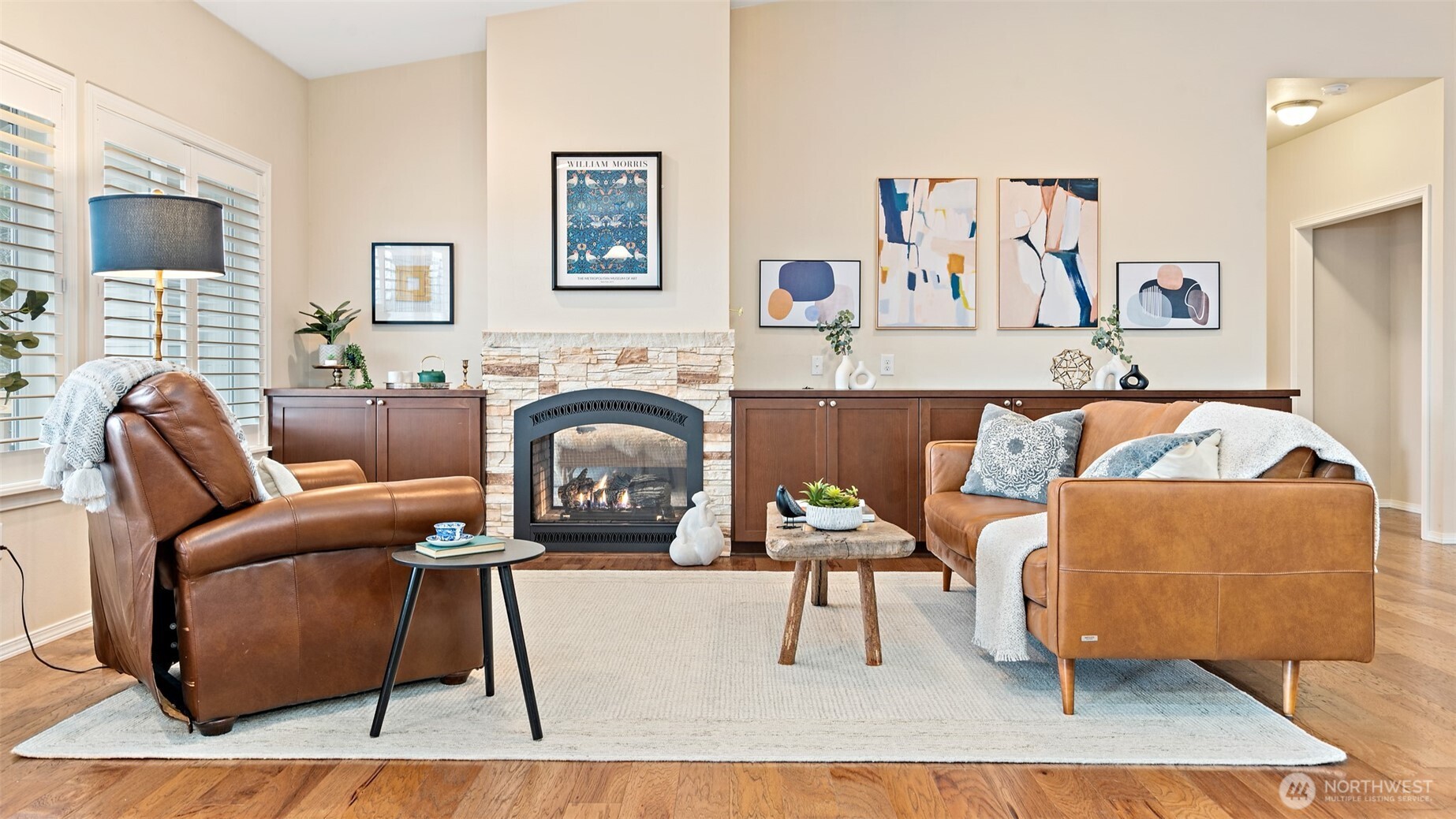 25965 Tytler Road Northeast Poulsbo, WA 98370 - Photo 6 of 40 a living room with furniture and a fireplace