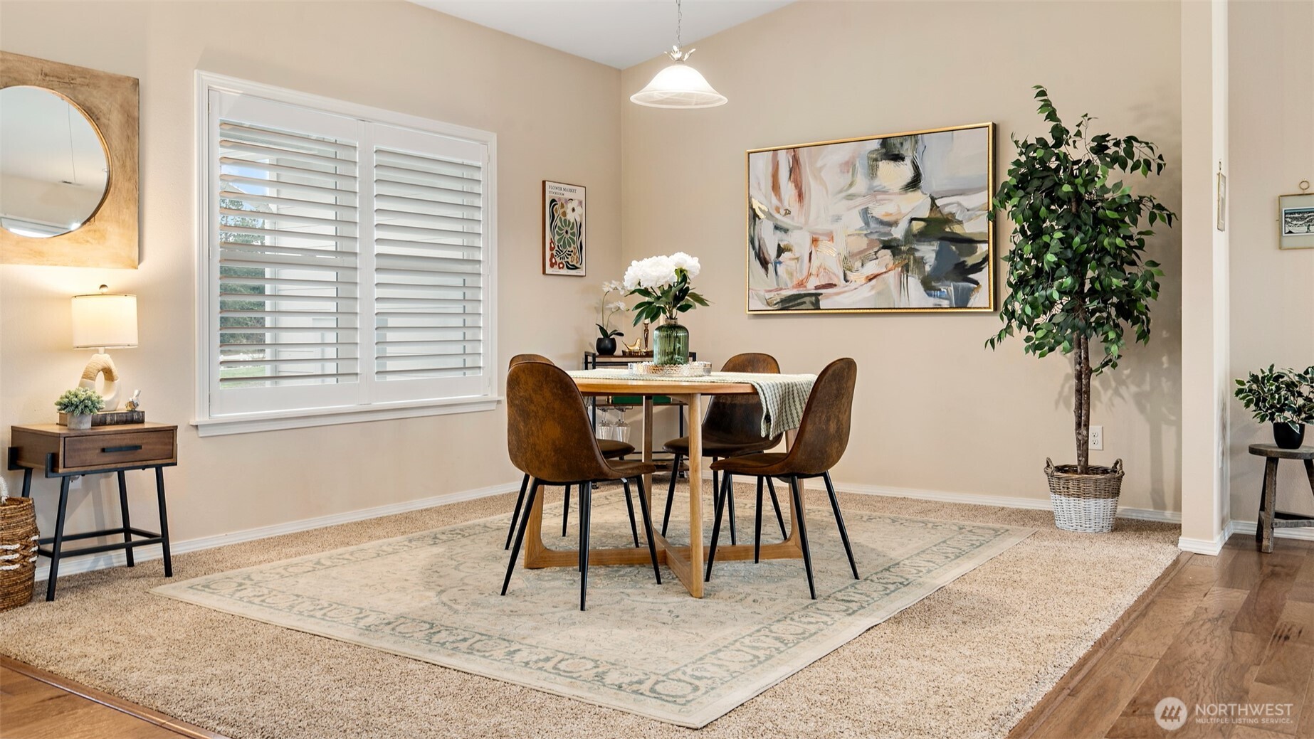 25965 Tytler Road Northeast Poulsbo, WA 98370 - Photo 7 of 40 a view of a dining room with furniture and a potted plant