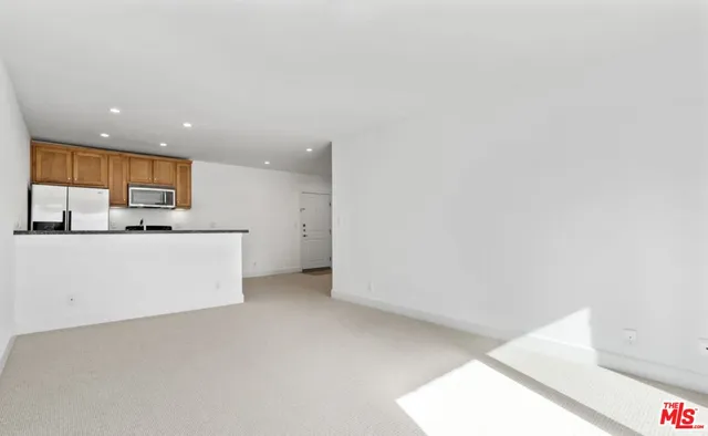a view of a kitchen with a sink