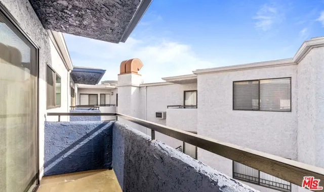 a view of a kitchen with granite countertop lots of clutter