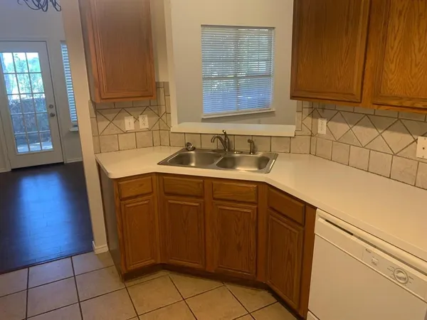 a kitchen with a sink and cabinets