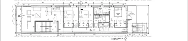 a black and white photo of a living room