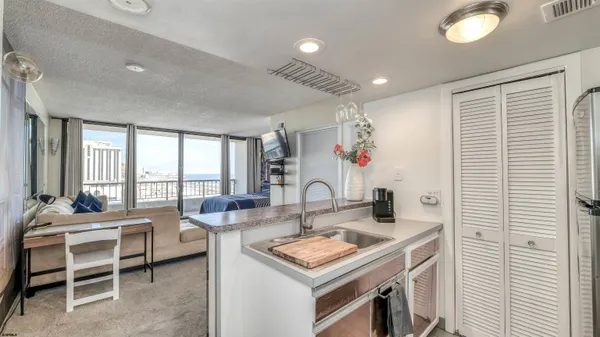 a very nice looking dining room with a large window and dining table