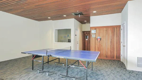 a view of a hallway with furniture