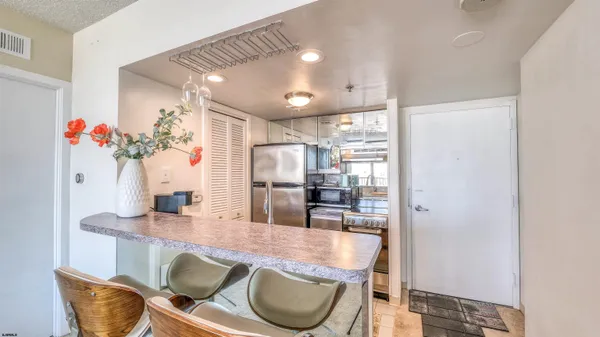 a dining room with furniture and wooden floor