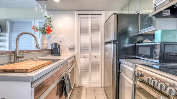 a kitchen with a sink and a stove top oven