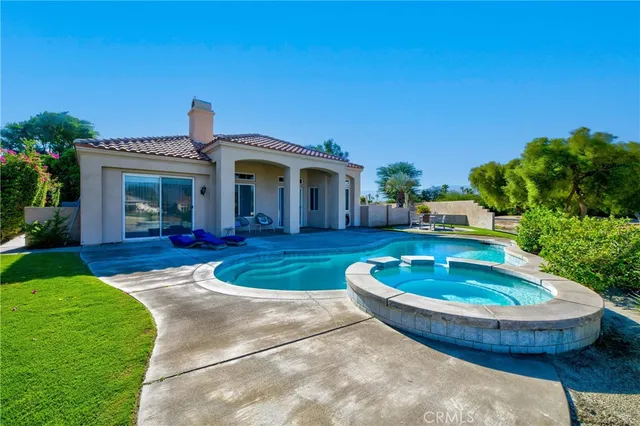 a view of a house with a swimming pool