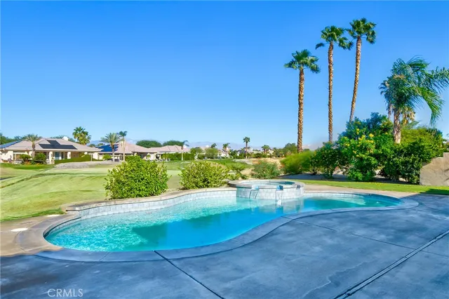 a view of a chairs and table in patio