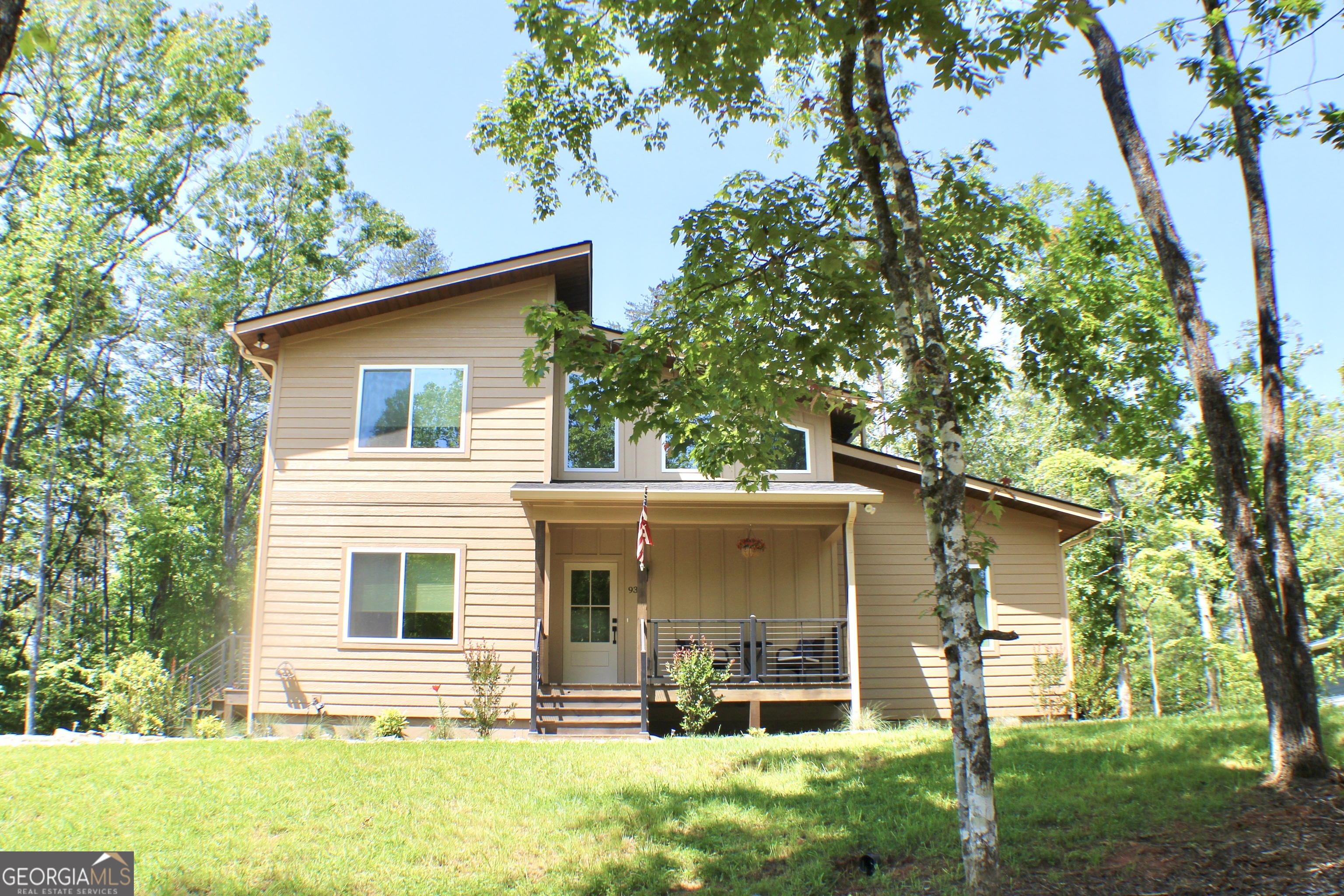 front view of a house with a yard